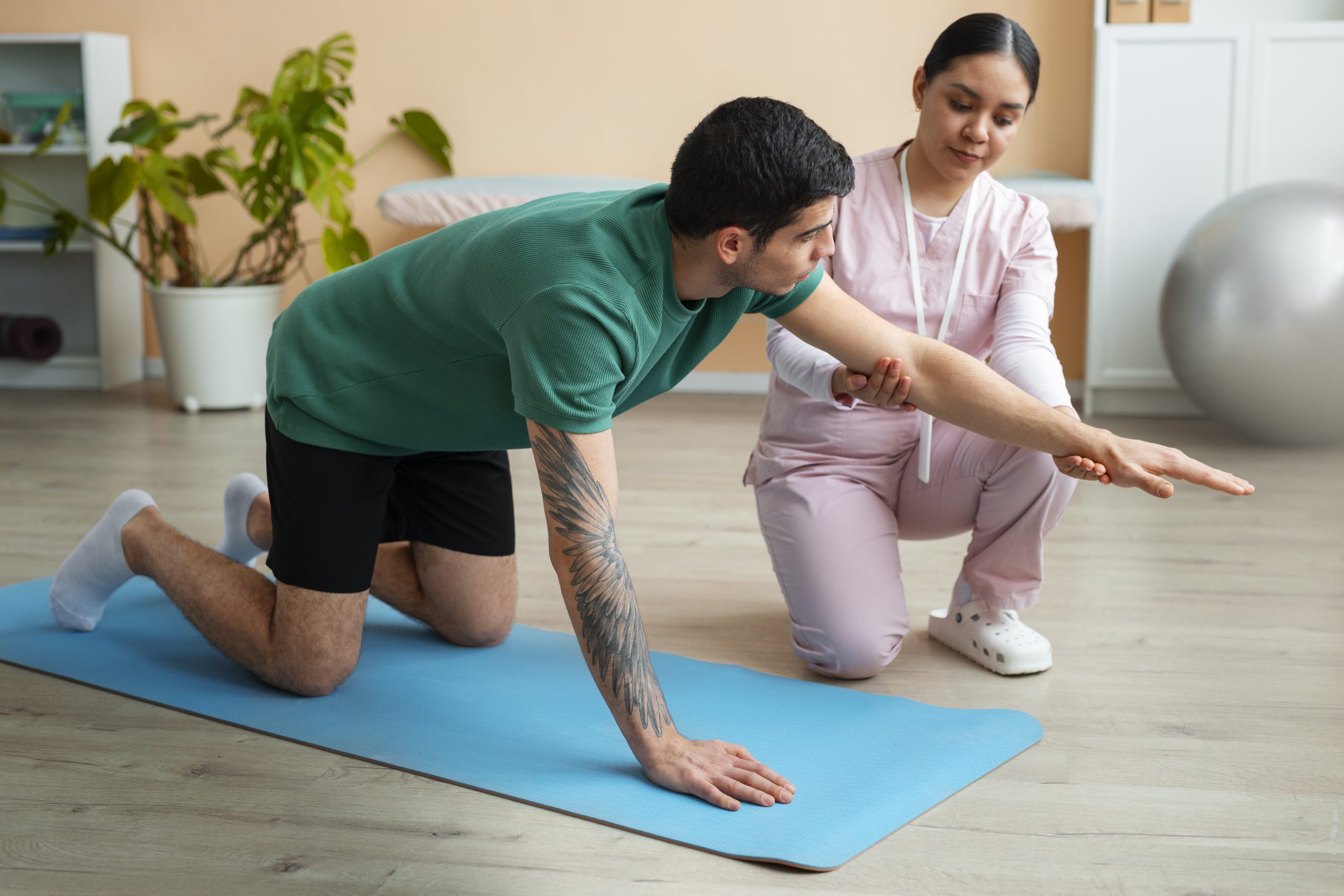 Physiotherapist assessing shoulder mobility at Inform Physio Carlton
